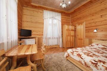 Фото номера Номер люкс семейный Гостиница Сокол г. Домбай 2