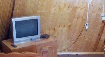 Фото номера Двухместный номер с 1 кроватью или 2 отдельными кроватями и общей ванной комнатой Гостиница Золотой Мустанг г. Домбай 4